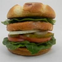 Salmon Burger  · Salmon burger, lettuce, tomato, onion, mayonnaise, pickles. 
