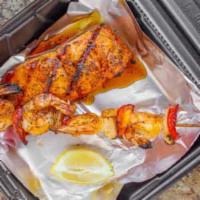 Seafood Combo Dinner · Salmon and shrimp. 4 pieces shrimp kabob. Comes with 2 sides. Add extra sauce and biscuits f...