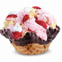Surrender to Strawberry · Strawberry ice cream with strawberries, yellow cake, & whipped topping.