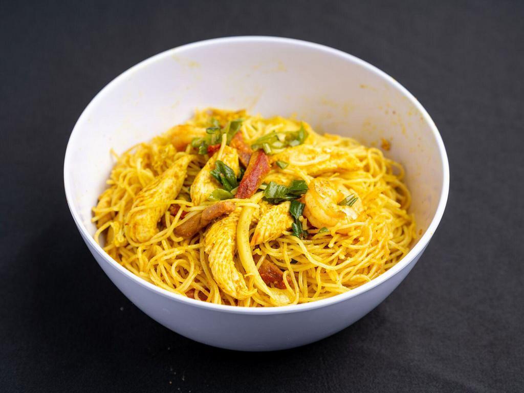 Singapore Noodles · Thin rice noodle with shrimp, chicken, pork, onion and red pepper with curry sauce. Hot and spicy.
