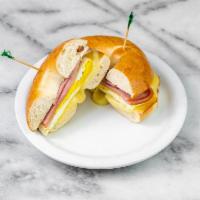Breakfast Sandwich · Egg, melted cheese, choice of bacon or smoked pork loin, choice of toasted bagel or toast.