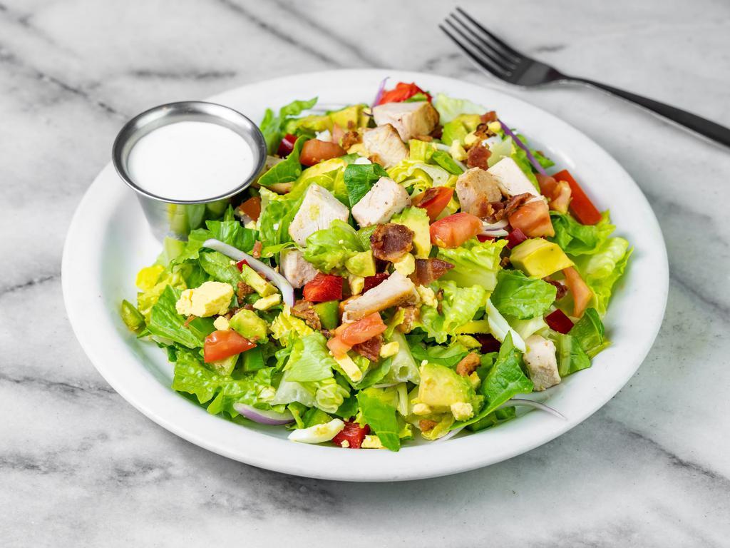Chop Chop Salad · Crisp romaine, avocado, smoked bacon, chicken breast, egg, bell peppers, onions, tomatoes and house blue cheese dressing.