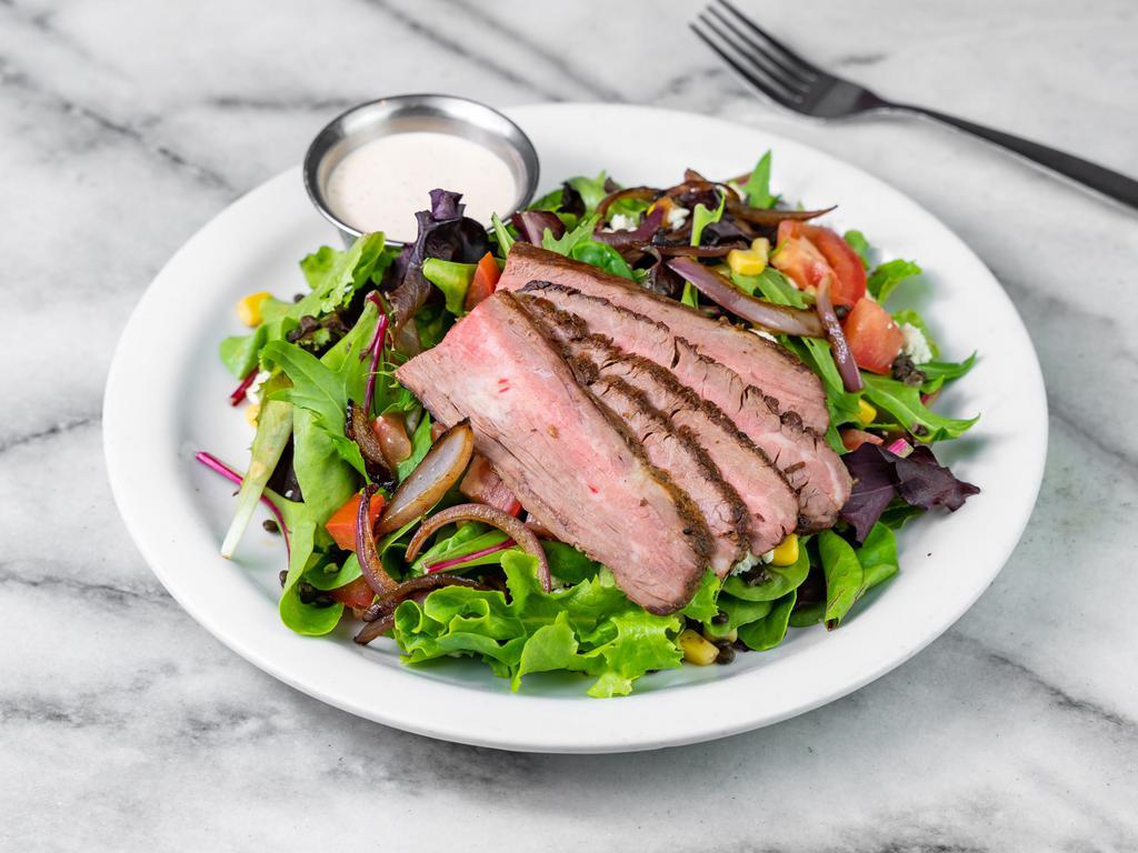 Steak n Blue Salad · Mixed greens, roasted flank steak, beluga lentils, corn, Stella blue cheese, caramelized onions, tomatoes and house chipotle ranch dressing.