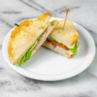 Tuna Melt Sandwich · Our signature albacore tuna salad with sunflower seeds, cheddar cheese, lettuce, tomato, aio...