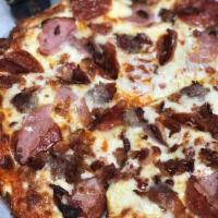 Meat Lover Pizza · Pepperoni, Italian sausage, bacon, ham and Canadian bacon.