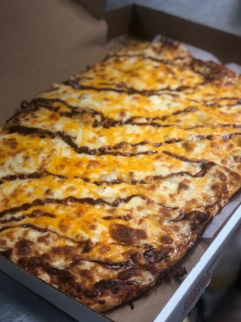 BBQ Chicken Pizza · BBQ sauce in place of red sauce, chicken, onion and shredded cheddar cheese.
