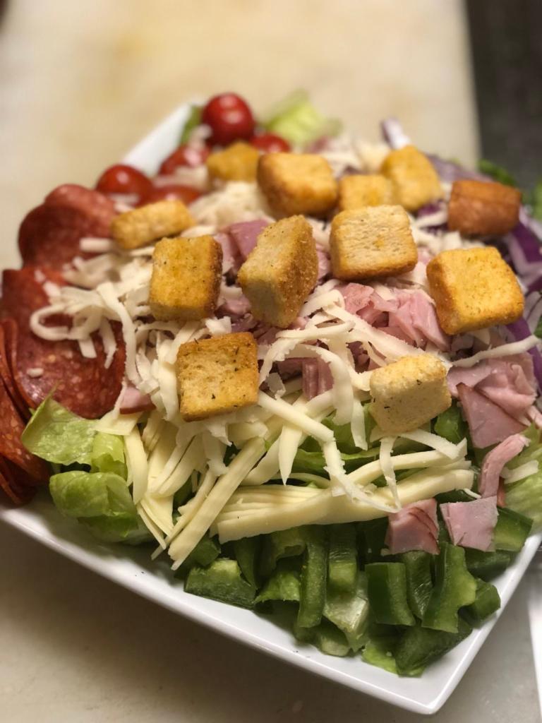 Antipasto Salad · Romaine lettuce, tomatoes, onions, green peppers, honey ham, pepperoni, provolone, mozzarella cheese and croutons.