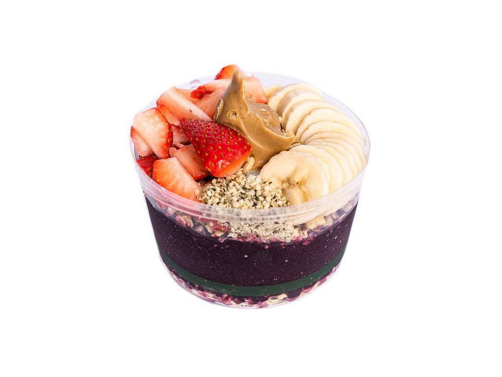 Acai on The Run · Acai topped with pumpkin seed and flax granola, banana, strawberry, hemp seed, and peanut butter. Vegan.