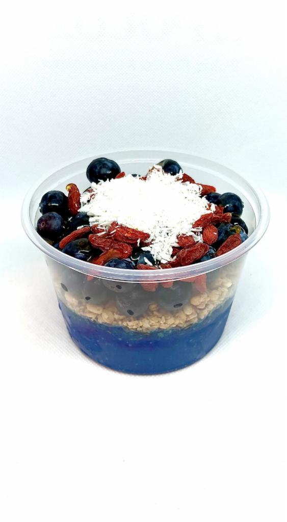 Mermaid Bowl  · banana, mango, pineapple, almond milk and blue majik spirulina blended together and topped with pumpkin seed and flax granola, blueberry, goji berry and coconut shreds