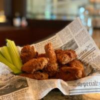 Wings · Lightly breaded wings served with celery choose from Buffalo, sweet chili, garlic Parmesan s...