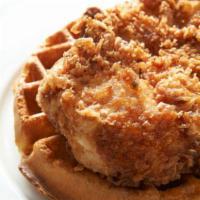 Pop's Chicken and Waffles · 4 southern fried pieces of chicken and one pops belgian waffle served hot with syrup and but...