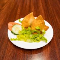 Samosa · Savory potatoes and peas in a fried pyramid pastry. Add chutney for no charge.