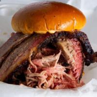 Meat Fight Sandwich · Sliced brisket and pulled pork piled high on our delicious bun! Comes with bag of original L...