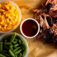Pulled Pork Family Pack · 1 lb of pulled pork, choose two sides, serves 2 adults, 2 kids 

Sauce on the side. 