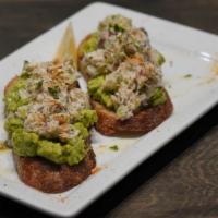 Avocado and Lump Crab Toast · Toasted artisan bread, fresh smashed avocado, citrus scented lump crab dusted with old bay a...