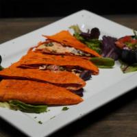 Smoked Salmon Quesadilla · Capers, red onions, white cheddar dill cream cheese,  roasted garlic and red peppers, wrappe...