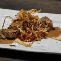 Tavern Tenderloin · Marinated grilled pork tenderloin, black eyed pea cassoulet, roasted garlic brown sauce and ...