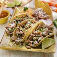 Taco Plate · 3 tacos served with rice and beans.
