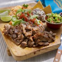 Regular Plate · Choice of meat served with rice, beans, guacamole, pico de gallo, and lettuce.