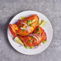 Tandoori Chicken · Gluten Free. One Breast one leg piece. Spicy chicken with yogurt, ginger, garlic, and spices...