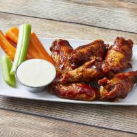 6 Pieces Wings · Cooked wing of a chicken coated in sauce or seasoning.