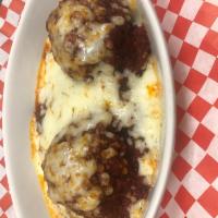 Baked Meatballs and Mozzarella · 2 meatballs baked in our homemade meat sauce and topped with loads of mozzarella cheese.