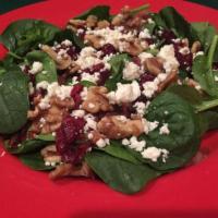 Spinach Salad · Fresh spinach, walnuts, dried cranberries, feta cheese, bacon bits and raspberry vinaigrette...