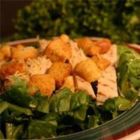 Chicken Caesar Salad · Lettuce, chicken breast, Caesar dressing, croutons and Parmesan cheese.