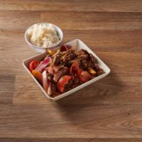 Lomo Saltado · Tender steak sauteed in olive oil with onions and tomatoes, served over french fries and rice.