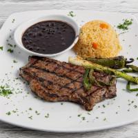 Carne Asada Plate · New York steak served with Mexican rice, refried beans, cheese, lettuce, avocado, pico de ga...