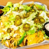 Nacho Platter · Taco beef, onions, peppers, jalapenos, nacho cheese, salsa, chipotle sour cream and shredded...