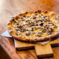 Tartufo Pizza Personal · Shredded mozzarella, wild mushrooms, truffle oil.