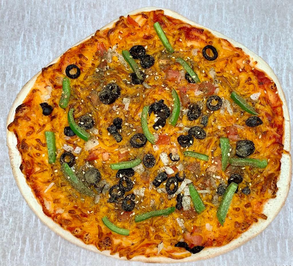 Pizza - Vegetarian · Vegetarian Pizza made with our special dough topped with Mozzarella cheese, Pepper, Olives, Onions, Tomatoes and a sprinkle of Thyme and Sesame mix over red pizza sauce.