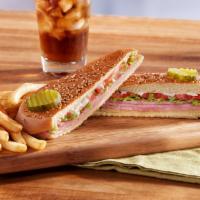 Slim Jim Sandwich · Lean ham, Swiss cheese, tomato, iceberg lettuce and Slim Jim sauce on a pressed and grilled ...