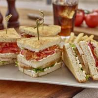 Triple-Decker Turkey Club Sandwich · Slow-roasted turkey breast with bacon, tomato, lettuce and mayo stacked on toasted sourdough...