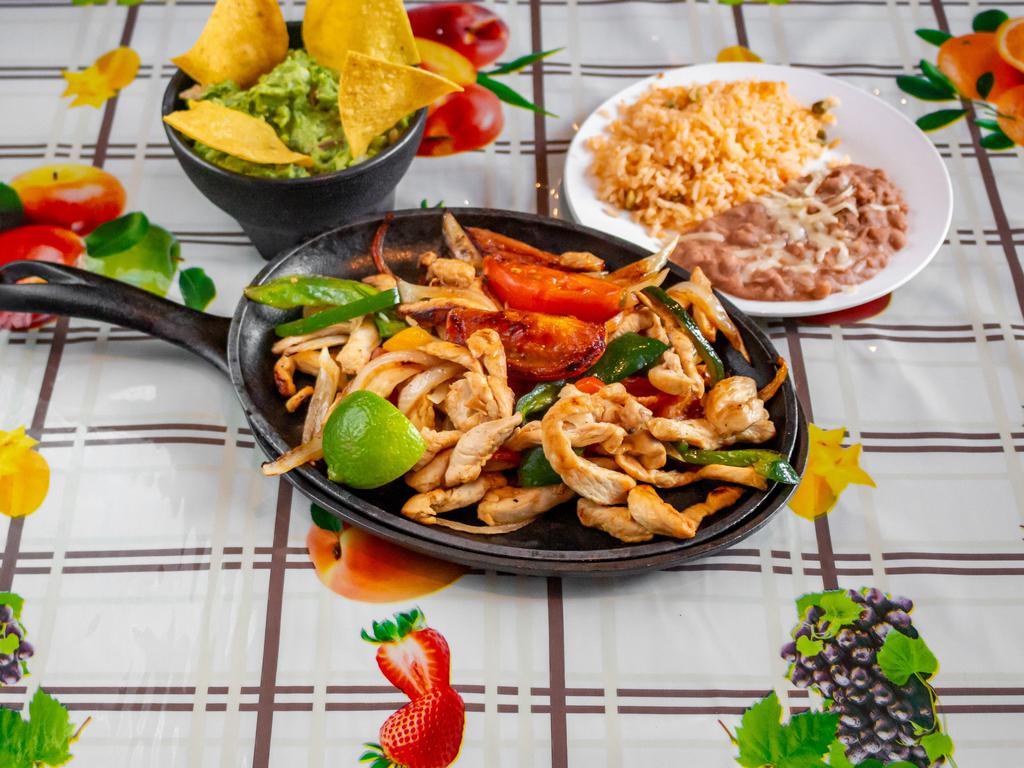 Fajitas (chicken) · Chicken fajitas cooked with bell peppers and grilled onions. Comes with sides of rice, beans, guacamole, sour cream, and pico de gallo. Tortilla of choice (corn or flour)