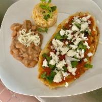 Sopes Dinner · 2 smaller thin masa tortillas topped with choice of meat, pinto beans, lettuce, tomato, onio...