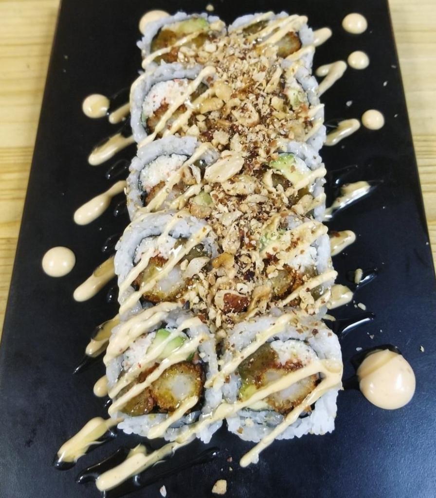 Ishigotto Roll · Shrimp tempura, kani, avocado, peanuts, honey truffle, and maduro.