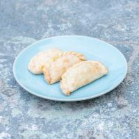 Veggie Empanada · All natural carrots, pumpkin and cheese. Seasoned with herbs from the orchard