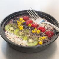 CHIA & BERRIES SMOOTHIE BOWL · Blended Banana & Berries topped with Strawberries, Blueberries, Kiwi, Mango, Coconut, Chia S...