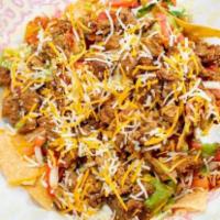 Carne Asaba Nachos · beans, meat, cheese guacamole and sour and cream