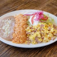 Huevos con Jamon · Ham and eggs. Served with rice, beans, lettuce, guacamole, and sour cream. 