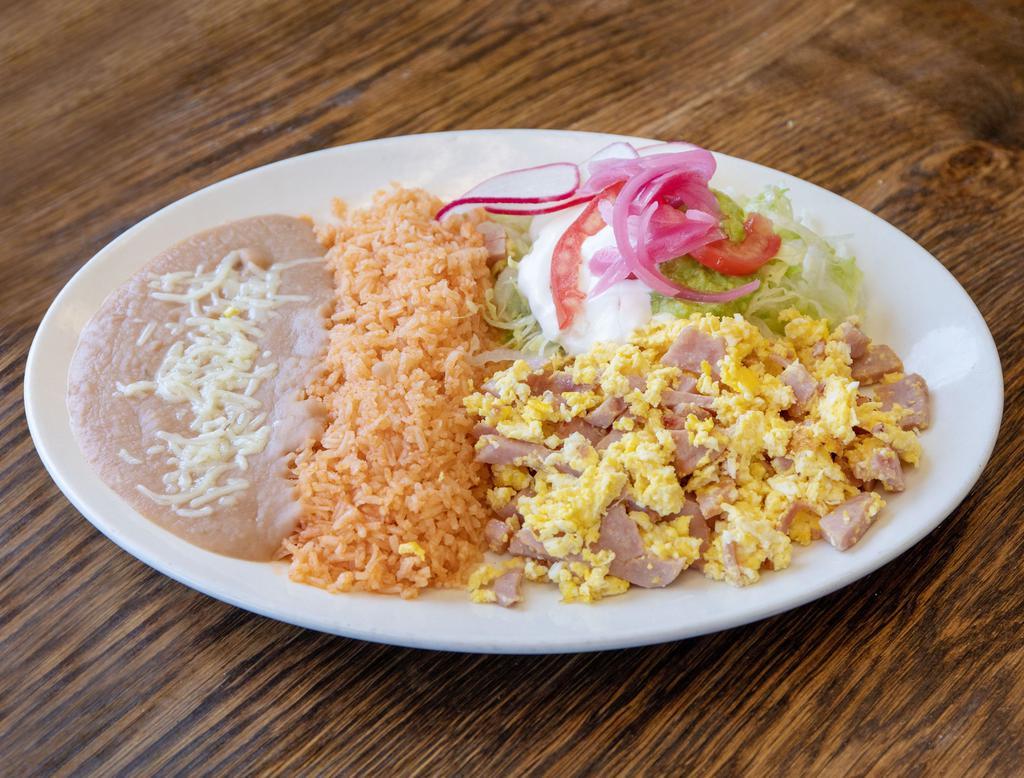 Huevos con Jamon · Ham and eggs. Served with rice, beans, lettuce, guacamole, and sour cream. 