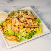 Chicken Caesar Salad · Romaine lettuce, Parmesan cheese, croutons, Caesar dressing and chicken. 