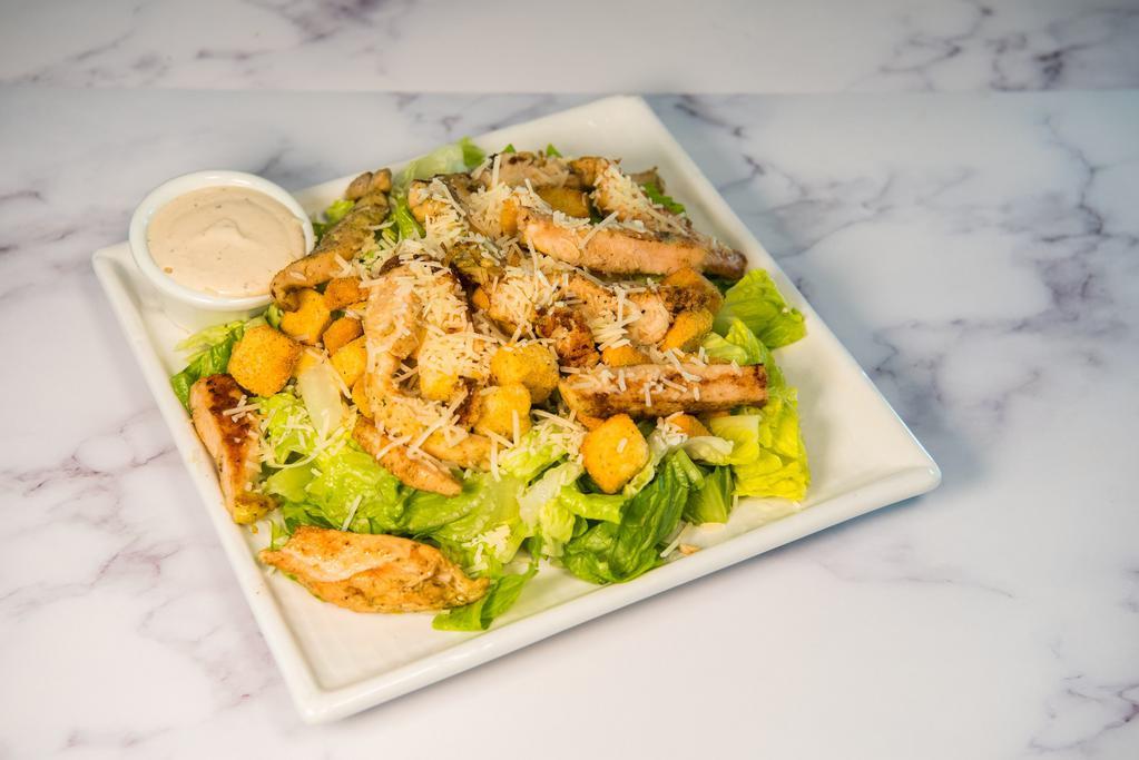 Chicken Caesar Salad · Romaine lettuce, Parmesan cheese, croutons, Caesar dressing and chicken. 