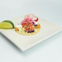 Fried Fish Taco · Corn tortillas, red and green cabbage, sour cream and fresh salsa., fried fish 
