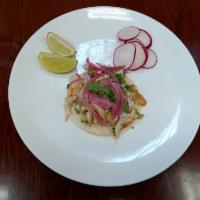 Fish Taco · Corn tortillas, fish, onions, cilantro and sauce. 