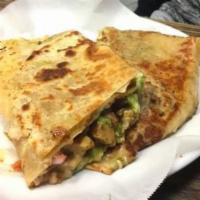 Mushroom Quesadilla · Flour tortilla with cheese, mushroom, red and green bell peppers and onions.
