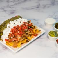 Vegetarian Nachos · Tortilla chips, beans, melted jack cheese, lettuce, sour cream, guacamole and salsa.
