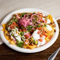 Super Nachos · Choice of meat, tortilla chips, beans, melted Jack cheese, sour cream, guacamole and salsa. 